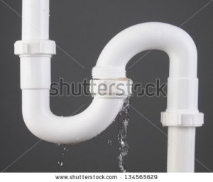 stock-photo-closeup-of-a-sink-s-trap-made-of-white-pvc-plastic-with-a-broken-connection-and-water-pouring-out-134565629